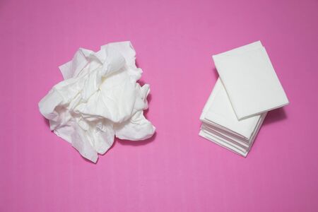 Used and new tissues on pink background. Concept of sick, flu and cold, crying, untidy, masturbation.の写真素材