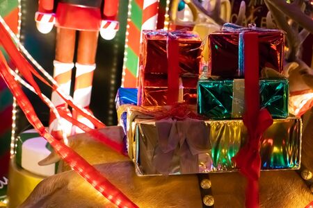 Christmas outside street decoration with lights, deer, presents, elves. Selective focus.の写真素材
