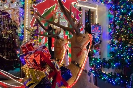 Christmas outside street decoration with lights, deer, presents, elves. Selective focus.の写真素材