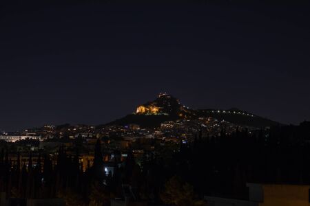Night view of mount lycabettus in athens greeceの写真素材