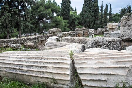 One broken columns with a huge crack laying on the ground in Athens. Ancient ruinsの写真素材
