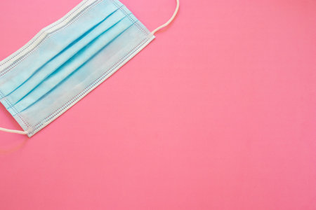 Surgical mask with rubber ear straps. Typical 3-ply surgical mask, masks pff2 and pff3 against...
