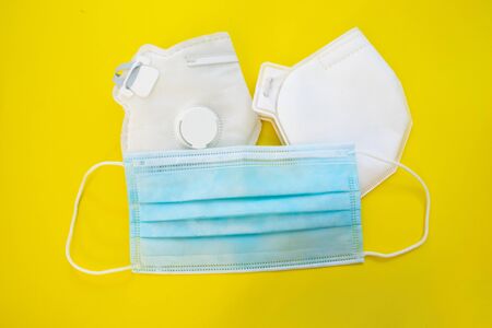 Surgical mask with rubber ear straps. Typical 3-ply surgical mask, masks pff2 and pff3 against covid.の写真素材