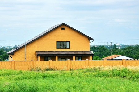 Facade of an orange apartment house in a rural placeのeditorial素材
