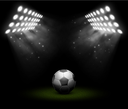 Soccer ball in light of searchlights