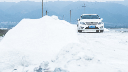 Mercedes Benz on snowy roadのeditorial素材