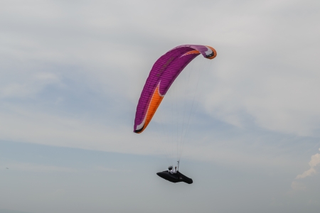 Paraglider flying in the skyの写真素材