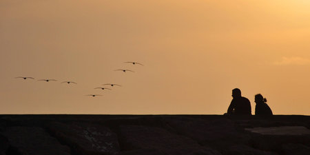 romance silhouette on beachの写真素材