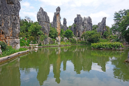 Rock formations by the pond at a park