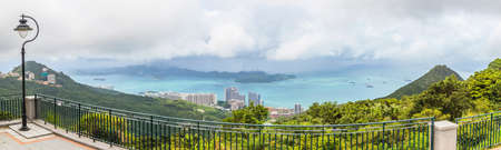 Panoramic picture over Hong Kong bsay from Mount High West Viewing Point during daytimeの写真素材