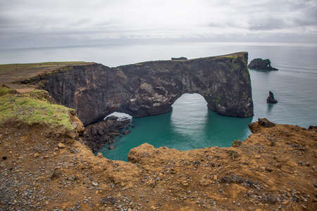 View on natural arches at Reynisfjara black beach in southern Iceland in summerの写真素材