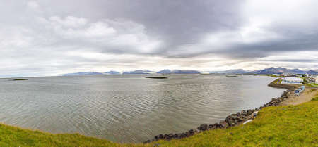 Panoramic picture of Vatnajoekull glacier tongues from Hoefn village in summerの写真素材