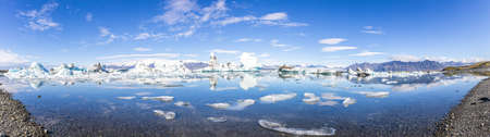 PanorPanoramic pictures over Joekularson glacier lagoon with frifting iceberg in summerの写真素材