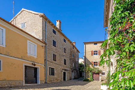Typical street scene of the medieval town of Groznjan on the Istrian peninsula without people during daytimeの写真素材