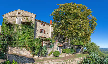 Typical street scene of the medieval town of Groznjan on the Istrian peninsula without people during daytimeの写真素材