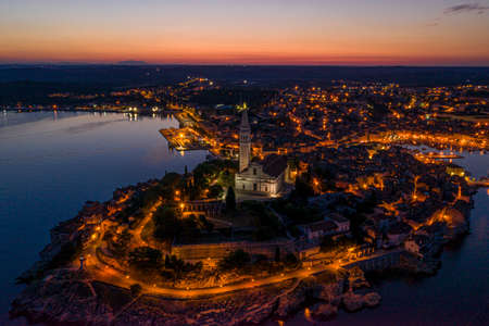 Panoramic aerial drone picture of the historic city Rovinj in Croatia during sunrise in summerの写真素材