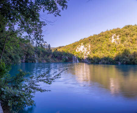 View on idyllic lake in the Plitvice lakes national park in Croatia during daytime in summerの写真素材