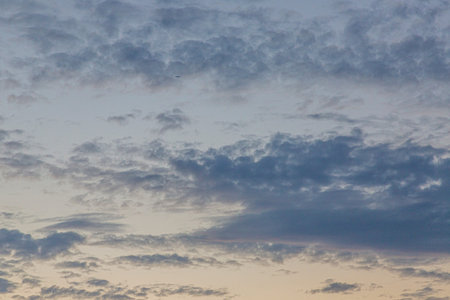 Dramatic colorful sky with afterglow and illuminated clouds at evening time