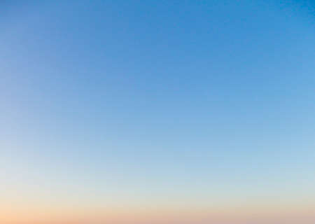 Dramatic colorful sky with afterglow and illuminated clouds at evening timeの写真素材
