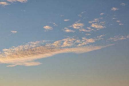 Dramatic colorful sky with afterglow and illuminated clouds at evening time