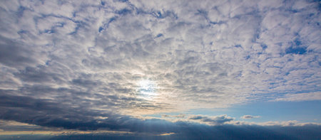 Dramatic colorful sky with afterglow and illuminated clouds at evening timeの写真素材