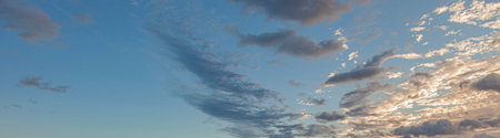 Dramatic colorful sky with afterglow and illuminated clouds at evening time