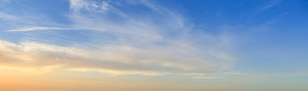 Dramatic colorful sky with afterglow and illuminated clouds at evening time
