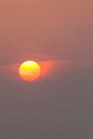 Picture of dramatic and colorful sky with sun during sunset in summer