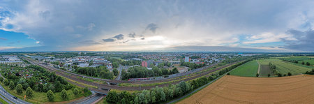 Drone panorama of German district town Gross-Gerau in south Hesse in the evening against cloudy sky...