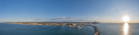 Drone panorama of the Spanish town of Vinaros with the large breakwater at the entrance to the port...