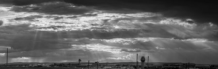 Panorama black and white image of frankfurt airport against impressive sky with wild cloud...