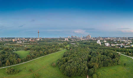 Drone panorama over Frankfurt skyline in evening light taken from Niddapark in summerの写真素材