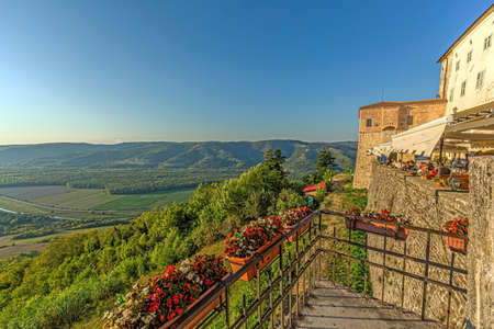 Panoramic view from the city wall of Motovun over the surrounding countryside during the day in summerの写真素材