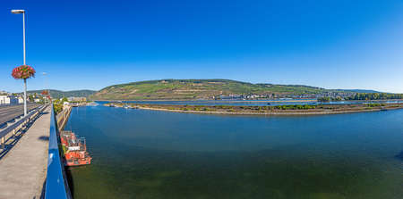 View of Ruedesheim and the Niederwald Monument from Bingen Rhine bankの写真素材