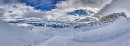 Panoramic image of a ski slope in Ifen ski resort in Kleinwalsertal valley in Austria during the...