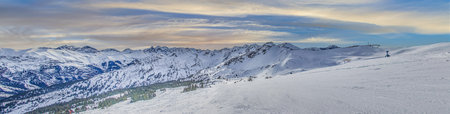 Panoramic image of a ski slope in Ifen ski resort in Kleinwalsertal valley in Austria during daytime