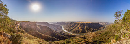 Panoramic picture of the lower part of the Blyde river canyon in South Africa in the afternoon against the lightの写真素材