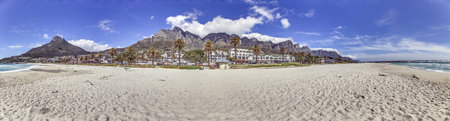 Panoramic view from the beach over the village of Camps Bay near Cape Town to the towering Table...