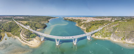 defaultPanoramic view of the freeway bridge over the Rio Mira near the town of Bairro Monte Vistoso in Portugal during the daytimeの写真素材