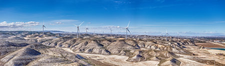 Drone panorama over a wind farm in a hilly desert landscape in Spain during the dayの写真素材