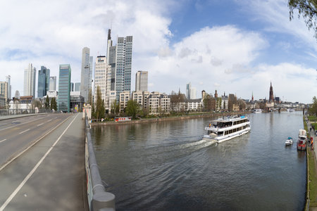 Panoramic picture of the Frankfurt skyline with Main and FriedensbrÃ¼cke during the dayの写真素材