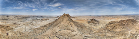 Drone panorama of the Spitzkoppe in Namibia during the day against a blue sky in summerの写真素材