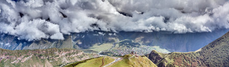 Drone view of Gergeti Trinity Church and Stepantsminda in the Caucasus mountains of Georgia during...