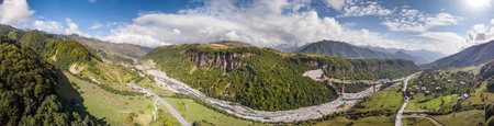 Drone view of a bridge construction site near Chartali village, Georgia, set in a mountainous landscape during daytimeの写真素材