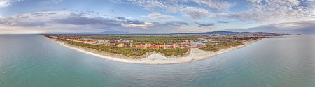 Drone panorama over Livorno beach in summer showing coastal sandy shore and nearby buildingsの写真素材