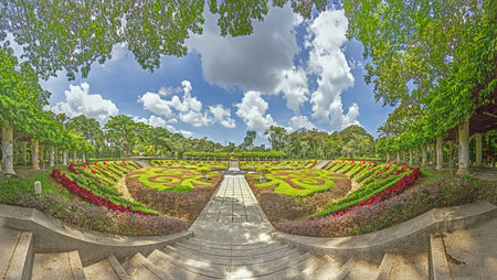 A panoramic view of a beautifully landscaped garden in Kuala Lumpur, featuring vibrant floral...