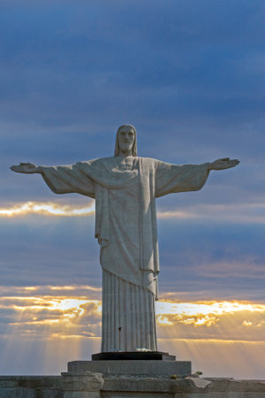 Majestic Christ the Redeemer statue in Rio de Janeiro with dramatic sky and sun rays in the background in 2010の写真素材
