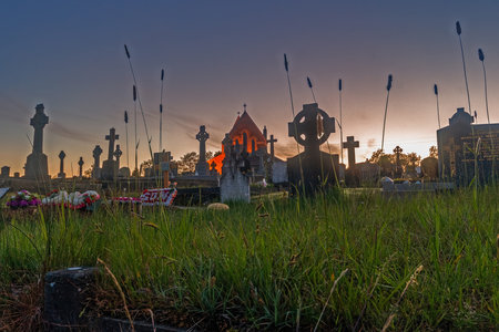Old Scottish cemetery with historic church at dusk in summer