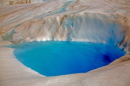 A vibrant meltwater lake on the surface of Gray Glacier in Patagonia during daytimeの写真素材