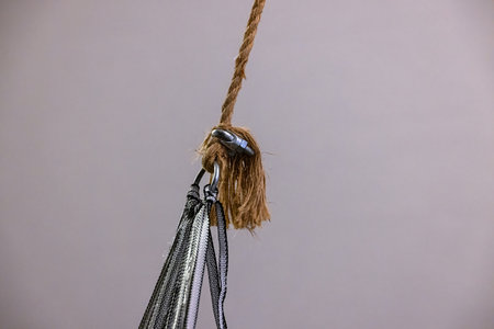 Strong rope knot connection with metal clip in detailed close upの写真素材
